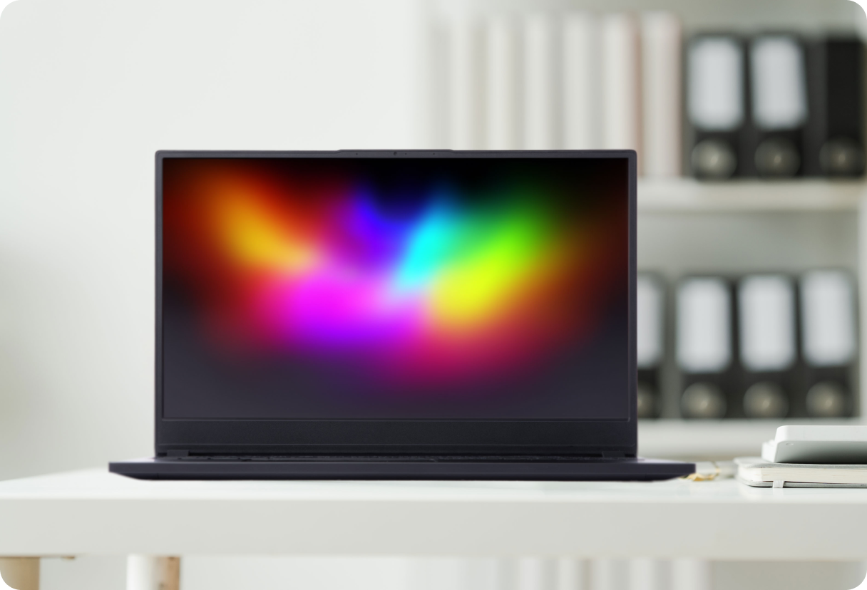 System76 laptop on a table with a colorful display.