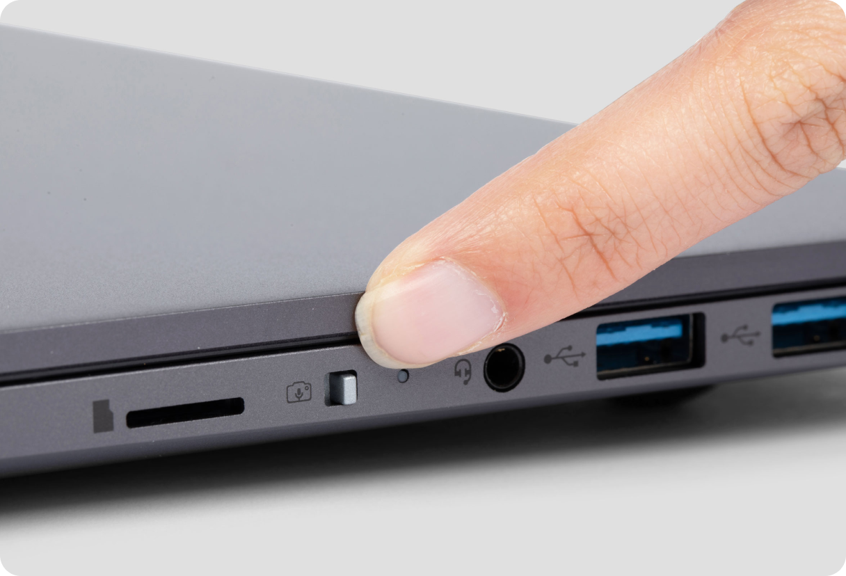 This user has just toggled their privacy switch off on the side of their closed laptop. No one can see or hear them now!